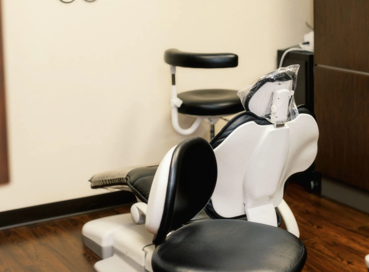 dental room of a dental clinic with a black and white medical reclining chair