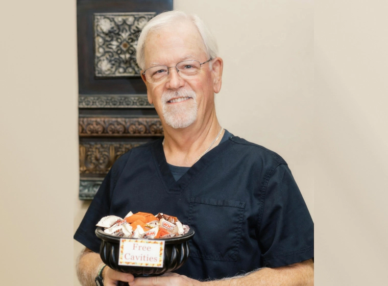 dentist holding platter of candies